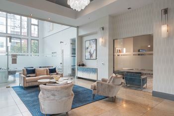 A spacious living room with a large sofa set and a television.